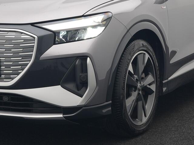 Audi Q4 e-tron 50 quattro S Line 77 kWh 299pk Dealer O.H. INCL BTW | Panodak | Lederen Sportstoelen Verwarmd | Keyless | Navigatie | Cruise Control | Virtual | DAB | Taifungrau Metallic |