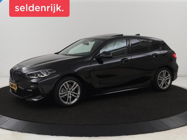 BMW 1-SERIE 118i M Sport | Panoramadak | Stoelverwarming | Camera | Sportstoelen | Harman/Kardon | Stuurverwarming | Carplay | Navigatie | Live Cockpit | Full LED | Getint glas