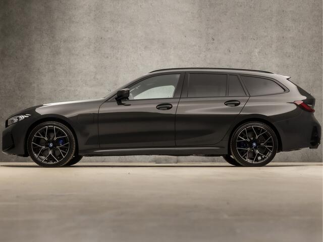 BMW 3-SERIE Touring 330e M-Sport 293Pk Automaat (DRAVITGRAU, FACELIFT, LASER KOPLAMPEN, HEAD-UP DISPLAY, CAMERA, M PAKKET, KEYLESS, MEMORY SEATS, ADAPTIVE CRUISE, SFEERVERLICHTING, APPLE CARPLAY, DAB+, NIEUWSTAAT)