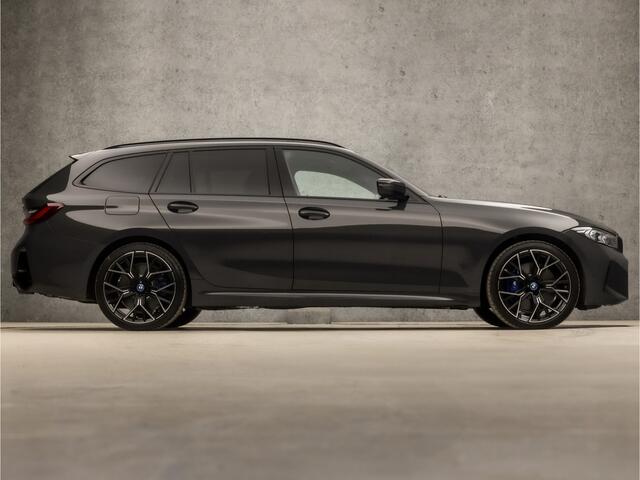 BMW 3-SERIE Touring 330e M-Sport 293Pk Automaat (DRAVITGRAU, FACELIFT, LASER KOPLAMPEN, HEAD-UP DISPLAY, CAMERA, M PAKKET, KEYLESS, MEMORY SEATS, ADAPTIVE CRUISE, SFEERVERLICHTING, APPLE CARPLAY, DAB+, NIEUWSTAAT)
