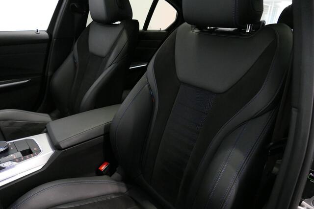 BMW 3-SERIE 330e xDrive M Sport / M340i Diffuser / Black Diamond M Grill / M340i M Sport bumper pakket / Schuif-/kanteldak / Premium kleur Dravitgrau / Apple Carplay - Android Auto / Stoelverwarming / Ambienteverlichting / 19'' LMV / Stuurwiel verwarming / Full LED /