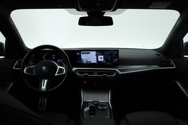 BMW 3-SERIE Touring 320e M Sport | Facelift | Shadow Line | Curved display | Adapt. Cruise | Nav + CarPlay | Elek. Klep | Sfeerverlichting | LED | Stoelverw. | PDC V
