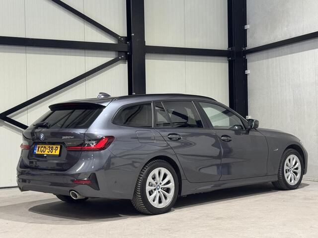 BMW 3-SERIE Touring 320e xDrive Business | panorama | navi | led | trekhaak |