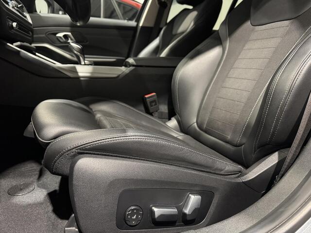 BMW 3-SERIE Touring 320e xDrive Business | panorama | navi | led | trekhaak |