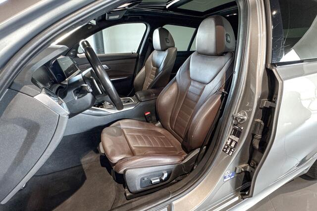 BMW 3-SERIE Touring M340i xDrive | Glazen Panoramadak | Harman Kardon | Stoelverwarming | Head-Up Display | Trekhaak |