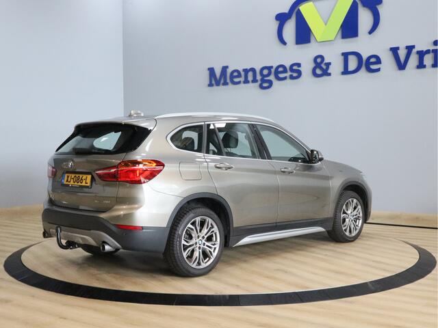 BMW X1 sDrive20i Orange Edition II Trekhaak | Stoelverwarming | LED | NAP | Head-Up display | Leder | Isofix