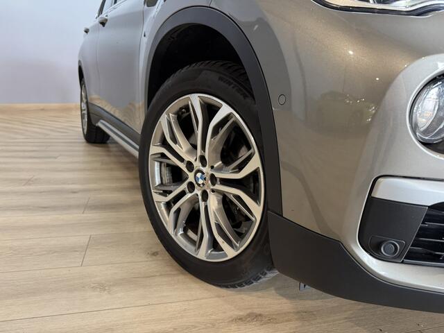 BMW X1 sDrive20i Orange Edition II Trekhaak | Stoelverwarming | LED | NAP | Head-Up display | Leder | Isofix
