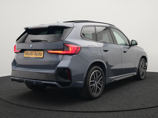 BMW X1 xDrive30e M-Sport Plug In Hybrid Storm Bay Metallic 326pk Dealer O.H. PHEV | Panodak | Lederen Sportstoelen Memory & Massage | Adaptive Cruise | Harman Kardon | Navigatie | 360 Camera | Head Up | Sfeerverlichting | Apple Carplay |
