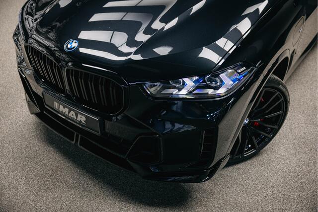 BMW X5 xDrive50e | Akrapovic | Head-up | Verwarmde en verkoelde bekerhouders | Pano |