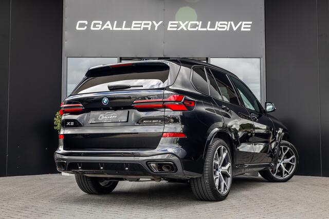 BMW X5 xDrive50e - M Sport Pro | Skylounge | B&W | Kuipstoelen | Luchtvering