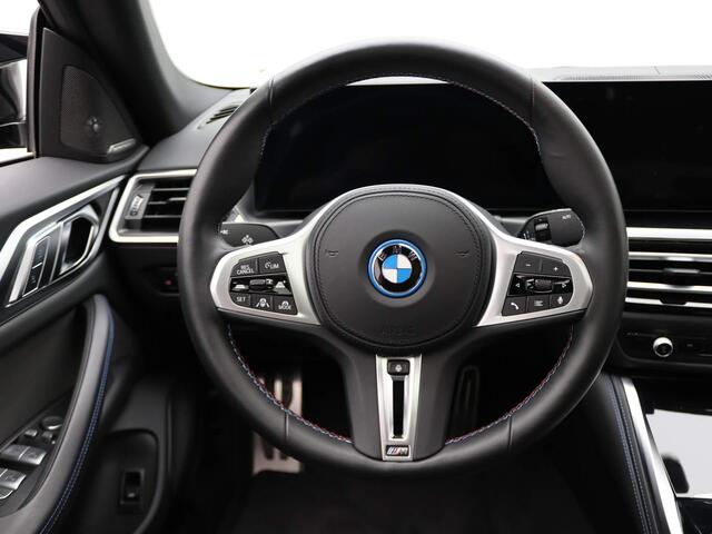 BMW i4 M50 | High Executive 84 kWh | M Sportpakket | Trekhaak | Driving Assistant Professional | Panoramadak