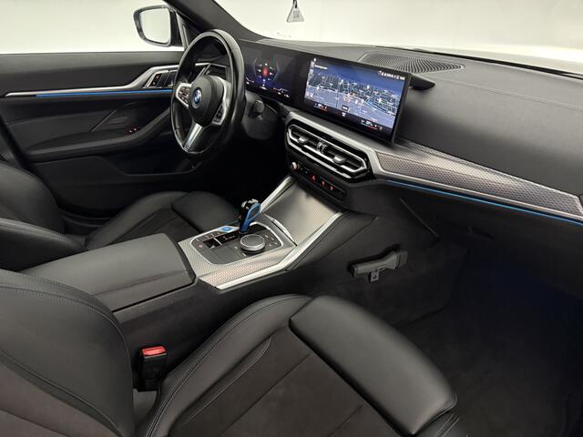 BMW i4 eDrive40 84 kWh M-Sport | M-Performance kit | Pano | 20''LMV | Widescreen | BMW-LED | Snelladen | SOH 92% | Camera | Sfeer | Virtual | Trekh. | Carplay