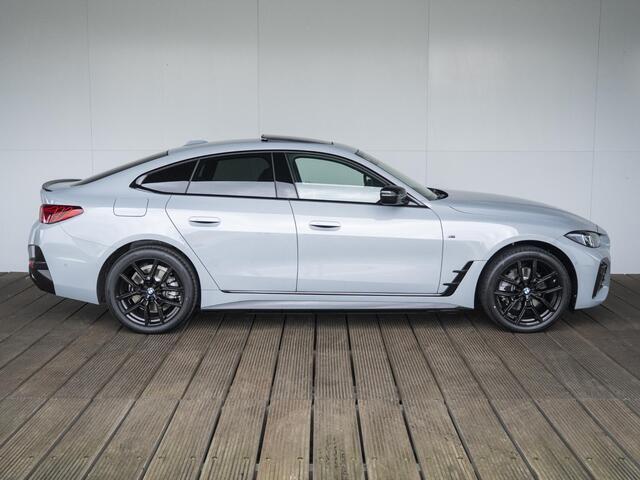 BMW i4 eDrive35 | M Sportpakket | Comfort Pack | Stuurwielrand verwarmd | Comfort Access | Achteruitrijcamera | Schuif-/kanteldak | Stoelverwarming