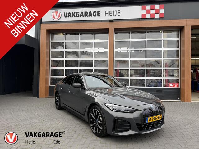 BMW i4 eDrive40 84 kWh | M-Pakket | Schuifdak | Dravitgrau metallic | NL-Auto |