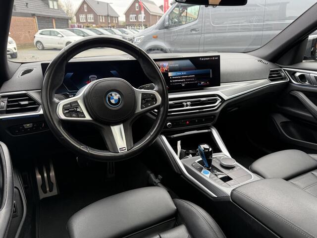 BMW i4 eDrive40 84 kWh | M-Pakket | Schuifdak | Dravitgrau metallic | NL-Auto |