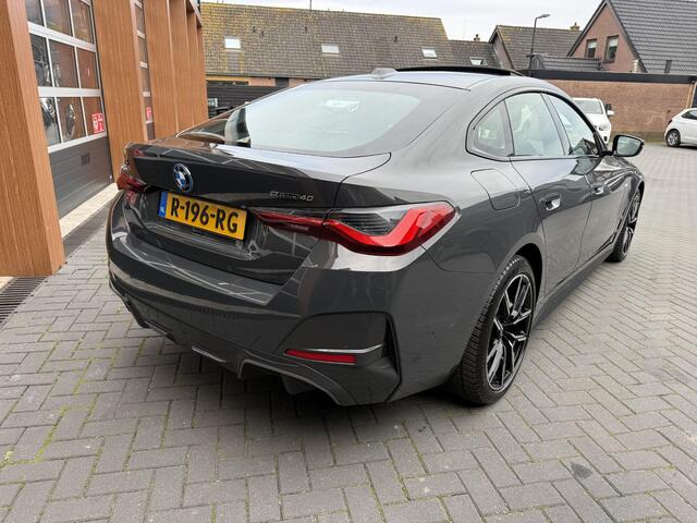 BMW i4 eDrive40 84 kWh | M-Pakket | Schuifdak | Dravitgrau metallic | NL-Auto |