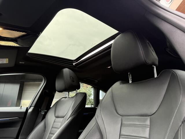 BMW i4 eDrive40 84 kWh | M-Pakket | Schuifdak | Dravitgrau metallic | NL-Auto |