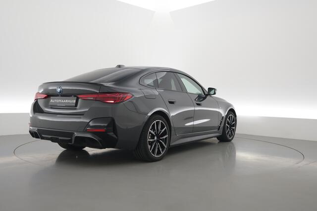 BMW i4 eDrive40 M Sport Pro 84 kWh | S/K-Dak | Elek. Trekhaak | Shadowline | Widescreen | Adapt. Cruise | Camera+PDC | Memory | Stoel-Stuurverw. | Nav+App.Connect V