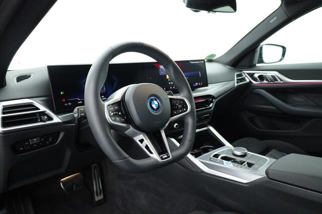 BMW i4 eDrive40 M Sport Pro 84 kWh | S/K-Dak | Elek. Trekhaak | Shadowline | Widescreen | Adapt. Cruise | Camera+PDC | Memory | Stoel-Stuurverw. | Nav+App.Connect V