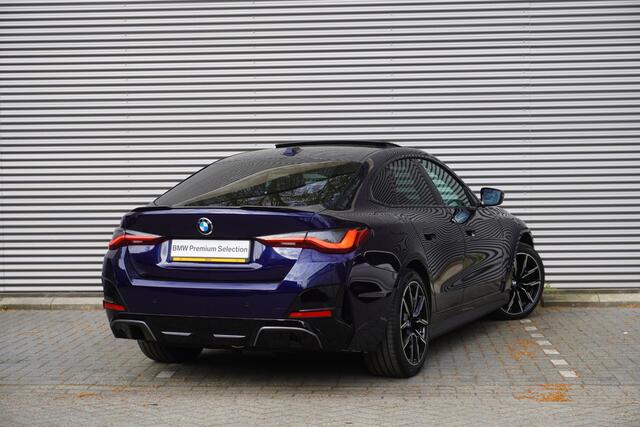 BMW i4 eDrive35 M Sportpakket | Comfort Pack | Stuurwielrand verwarmd | Trekhaak met elektrisch wegklapbare kogel | Elektrisch bediend glazen schuif-/kanteldak | Extra getint glas