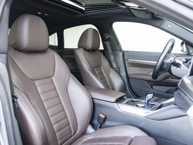 BMW i4 Gran Coupé M50 | M Sportpakket | High Executive | Stuurwielrand verwarmd | Adaptief M Onderstel | Glazen schuif-/kanteldak | Driving Assistant Professional | Trekhaak