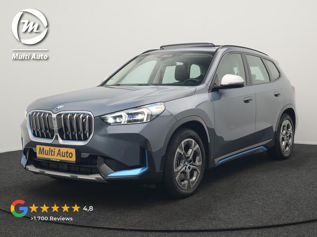 BMW iX1 xDrive30 Launch Edition 313pk Dealer O.H | Panodak | Adaptive Cruise | 360 Camera | Lederen Comfortzetels Massage & Memory | Head Up | Harman Kardon | Keyless |