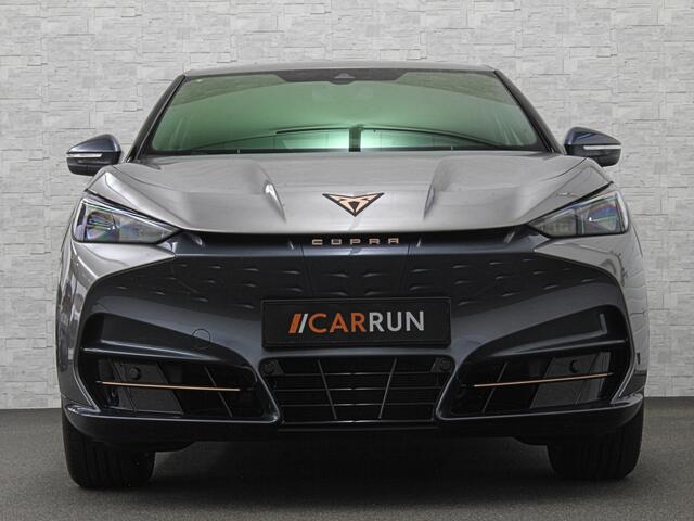 Cupra Tavascan 77 kWh | Nieuw! | Winter-Pack | Warmtepomp | Verlengde Fabrieksgarantie | 7x Op Voorraad | Adaptive Cruise Control | 3-Zone Clima | Verwarmde Voorruit | Keyless-Entry | Sfeerverlichting | Stoelverwarming | Carplay | Stuurverwarming | Getint Glas | 19 inch