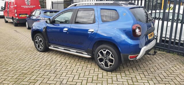 Dacia DUSTER 1.0 TCe Bi-Fuel Serie Limitee 15th Anniversary MEERDERE FOTO'S VOLGEN NOG. APPLE CARPLAY ANDROID AUTO / TREKHAAK / CLIMATE CONTROLE PARKEERSENSOREN+CAMERA / CRUISE CONTROLE.