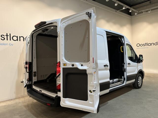 Ford E-Transit 390 (3500 kg) L2H2 Trend 68 kWh / 100% Elektrisch !! / Airco / Cruise Control / CarPlay / Camera / Navigatie / 3-Zits / 12.700 KM !!