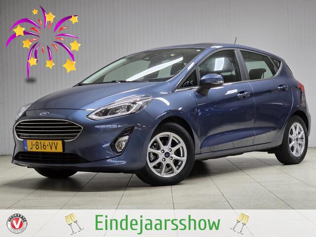 Ford FIESTA 1.0 EcoBoost Titanium/ 15'' LMV/ DAB+/ Lane-Assist./ 15'' LMV/ Clima/ Cruise/ Elek. pakket/ Isofix/ Bluetooth/ Armsteun/ Multi. LEDER. Stuur/ Mistl./ PDC/ LED Dagrijverl.