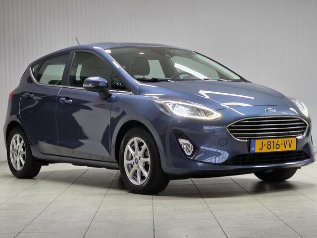Ford FIESTA 1.0 EcoBoost Titanium/ 15'' LMV/ DAB+/ Lane-Assist./ 15'' LMV/ Clima/ Cruise/ Elek. pakket/ Isofix/ Bluetooth/ Armsteun/ Multi. LEDER. Stuur/ Mistl./ PDC/ LED Dagrijverl.