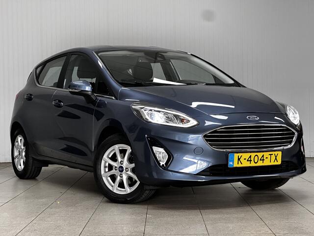 Ford FIESTA 1.0 EcoBoost Titanium/ 15'' LMV/ LED Koplampen/ DAB+/ Lane-Assist./ Clima/ Cruise/ Elek. pakket/ Isofix/ Bluetooth/ Multi. LEDER. Stuur/ Mistl./ PDC/ Chroom/ LED Dagrijverl.