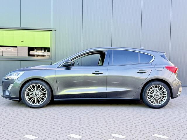 Ford FOCUS 1.0 EcoBoost Titanium Business 125 PK | Navigatie | Bang & Olufsen | Apple CarPlay | Android auto | Parkeersensoren | Camera | Climate control | Draadloze telefoonlader | Lichtmetalen velgen | Adaptieve cruise control |
