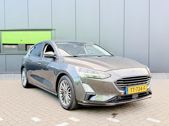 Ford FOCUS 1.0 EcoBoost Titanium Business 125 PK | Navigatie | Bang & Olufsen | Apple CarPlay | Android auto | Parkeersensoren | Camera | Climate control | Draadloze telefoonlader | Lichtmetalen velgen | Adaptieve cruise control |