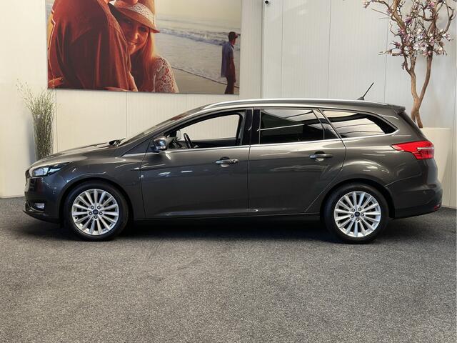 Ford FOCUS Wagon 1.0 Titanium NAVIGATIE CRUISE CONTROL STOEL EN STUURVERWARMING APPLE CARPLAY/ANDROID RIJSTROOKSENSOREN DODEHOEKSENSOREN KEYLESS GO TREKHAAK ACHTERUITRIJCAMERA ZEER MOOI !! 3010