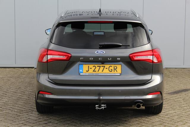 Ford FOCUS Wagon 1.0-125pk EcoBoost Titanium Business. Uiterst nette, comfortabele en ruime stationcar. Stoel-, stuur- en voorraamverw., Trekhaak, B&O soundsyst, lane assist, adaptieve cruise cntrl, camera a, LM wln, navigatie, telefoonvoorb. etc