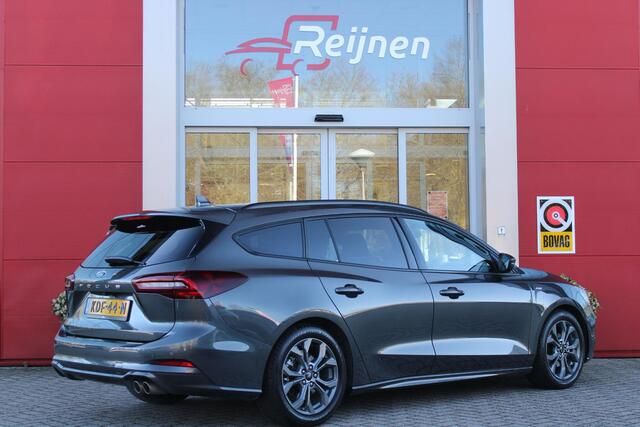 Ford FOCUS Wagon 1.0 155PK AUTOMAAT Hybrid ST LINE | ALL SEASON BANDEN | NAVIGATIE | DRAADLOZE APPLE CARPLAY/ANDROID AUTO | ADAPTIVE CRUISE CONTROL | LANE ASSIST | DODEHOEK DETECTIE | PARKEERSENSOREN VOOR + ACHTER | ACHTERUITRIJ CAMERA | LICHTMETALEN VELGEN 17" | DA