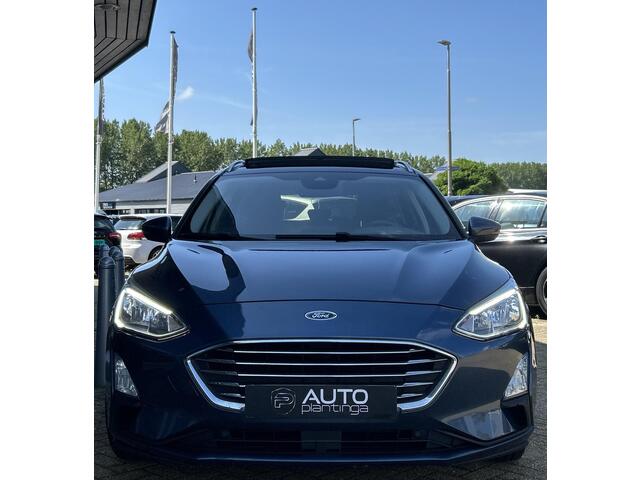 Ford FOCUS Wagon 1.0 EcoBoost Titanium Business 125PK | PANO | 2e Eigenaar | NL AUTO | Onderhoudshistorie | NAP | Elektrische Achterklep | Parkeersensoren | Winter Pack | Stoel Stuur en Voorruitverwarming | Climate Control | Cruise Control | Navigatie | Carplay | 2 