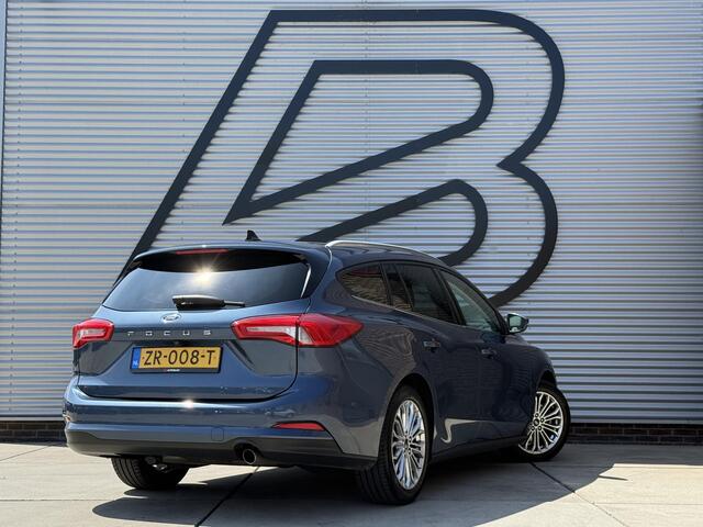 Ford FOCUS Wagon 1.0 EcoBoost Titanium Business 2e Eigenaar|Pano|Stoel+stuurverw|Adap Cruise|Carplay|HUD|Dealer Onderhouden|Camera|Clima|PDC V+A|Trekhaak|LM velgen|Navi|Elek Ramen|N.A.P.|APK tot 07-2027