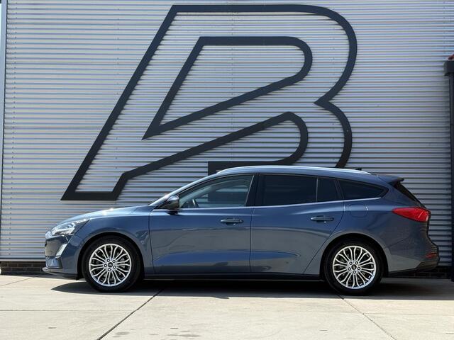 Ford FOCUS Wagon 1.0 EcoBoost Titanium Business 2e Eigenaar|Pano|Stoel+stuurverw|Adap Cruise|Carplay|HUD|Dealer Onderhouden|Camera|Clima|PDC V+A|Trekhaak|LM velgen|Navi|Elek Ramen|N.A.P.|APK tot 07-2027
