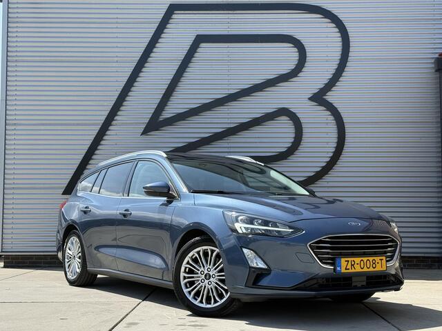 Ford FOCUS Wagon 1.0 EcoBoost Titanium Business 2e Eigenaar|Pano|Stoel+stuurverw|Adap Cruise|Carplay|HUD|Dealer Onderhouden|Camera|Clima|PDC V+A|Trekhaak|LM velgen|Navi|Elek Ramen|N.A.P.|APK tot 07-2027