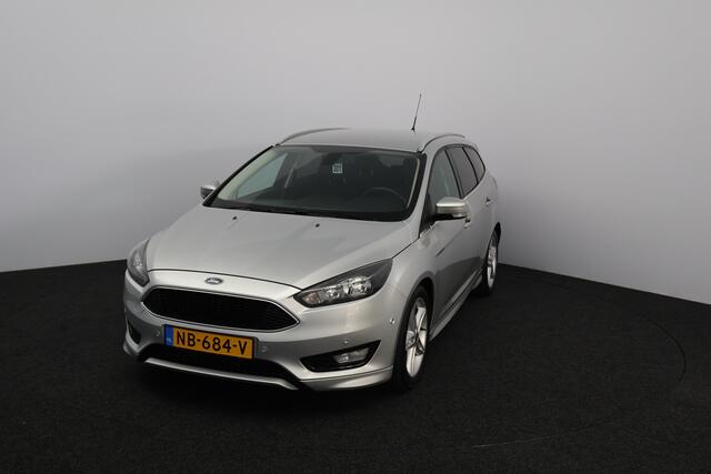 Ford FOCUS Wagon 1.0 Titanium /D-Riem Verv. 150.000KM! /Trekhaak! /Apple + Android /Voorruitverw. /Navi /Climat /Cruise /Elek. pakket /Bluetooth /17"LMV /Extra getint glas /PDC V+A /Mistlampen /LED Dagrijverl. /Dakrails.