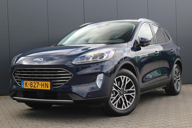 Ford KUGA 2.5 PHEV Titanium X | Incl. 12 maanden garantie | Cruise control | Head-up display | Dodehoek detectie | Elektrisch bedienbare achterklep | Licht metalen velgen | Airco | Parkeersensoren voor/achter | Parkeercamera voor/achter
