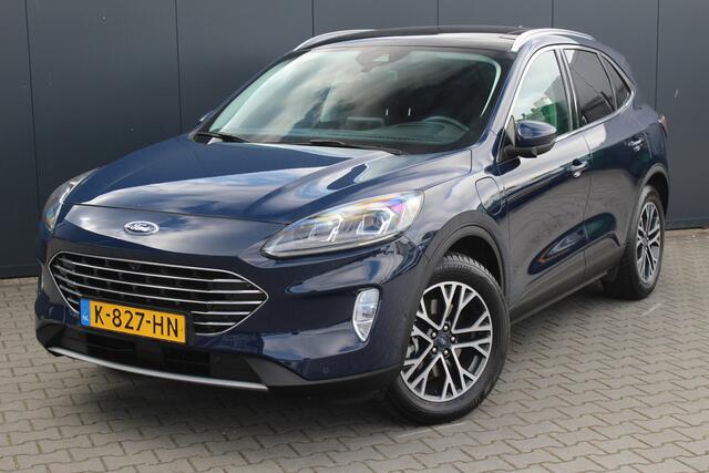 Ford KUGA 2.5 PHEV Titanium X | Incl. 12 maanden garantie | Cruise control | Head-up display | Dodehoek detectie | Elektrisch bedienbare achterklep | Licht metalen velgen | Airco | Parkeersensoren voor/achter | Parkeercamera voor/achter