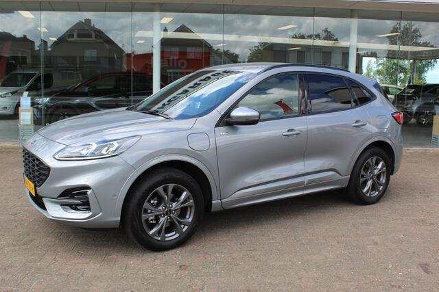 Ford KUGA 2.5-225pk PHEV ST-Line X. 1500kg Trekgewicht Fabr. garantie t/m 04-03-2028 ! Slechts 13.000km ! Autm. airco dual, side- en lane assist, camera v+a, parkeersensoren, elektr. achterklep, stoel-, stuur- en voorraamverw., metallic lak, head-up displ., B&O sou