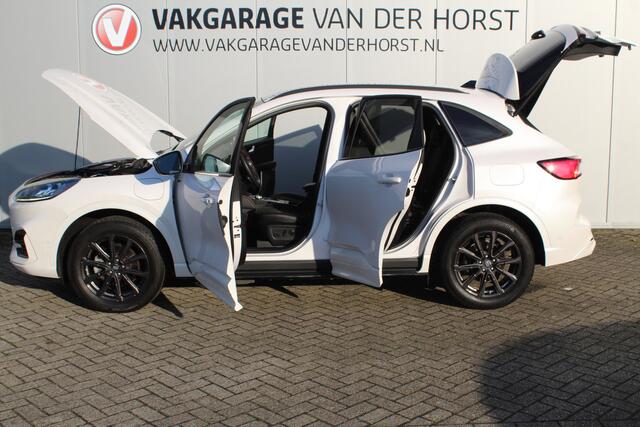 Ford KUGA 2.5-225pk Plug-in Hybrid ST-Line X. Hybride rijden voor een reële prijs ! Autm. airco dual, side- en lane assist, adaptieve cruise cntrl, camera v+a, stoel-, stuur- en voorraamverw., elektr. achterklep, metallic lak, navigatie, telefoonvoorb. etc.