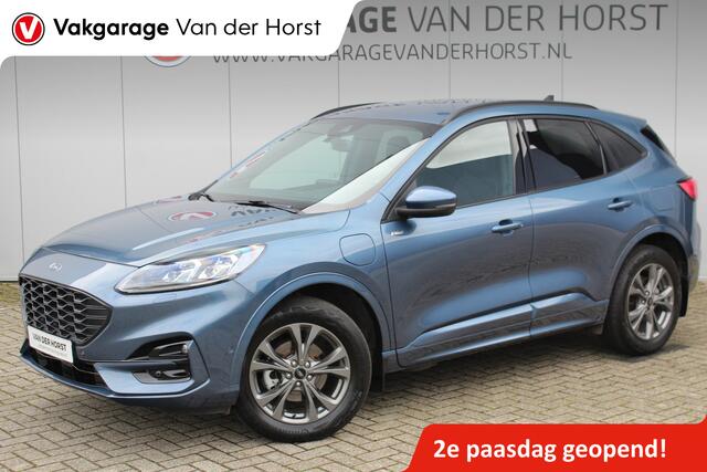 Ford KUGA 2.5-225 pk PHEV ST-Line X. Hybride rijden voor een reëel bedrag ! Slechts 31.500km ! Stoel-, stuur-, achterbank en voorraamverw., B&O soundsyst., Adaptieve Cruise Control, Climate Control dual, Camera v+a, Navigatie, Telefoonvoorb., Side- en lane assist e