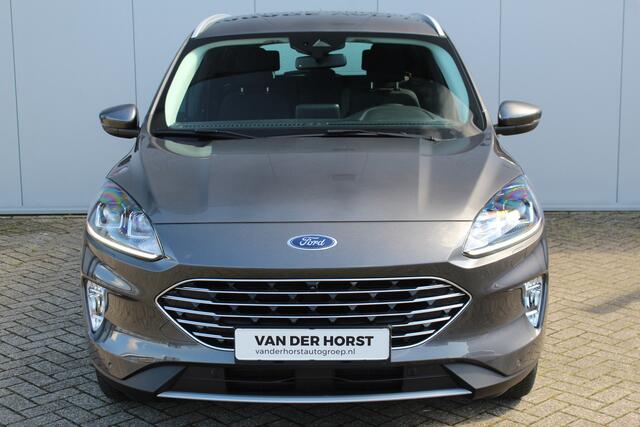 Ford KUGA 2.5-225 pk PHEV Titanium X Plug-In Hybrid-Automaat. Hybride rijden voor een reële prijs ! Adapt. Cruise Cntrl, Climate Cntrl, Navigatie, Side- en Lane assist, Telefoonvoorb., Keyless entry/keyless go, Stoel- en voorraamverw., Camera v+a, All season banden