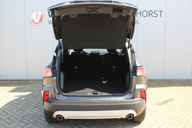 Ford KUGA 2.5-225 pk PHEV Titanium X Plug-In Hybrid-Automaat. Hybride rijden voor een reële prijs ! Adapt. Cruise Cntrl, Climate Cntrl, Navigatie, Side- en Lane assist, Telefoonvoorb., Keyless entry/keyless go, Stoel- en voorraamverw., Camera v+a, All season banden