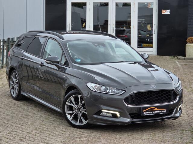 Ford MONDEO Wagon 1.5 ST Line NAVIGATIE|CAMERA|XENON LED|LEDER|KEY LESSGO &ENTRY|GETINT GLAS|TREKHAAK AFNEEMBAAR|18 INCH Maandag tot Vrijdag geopend van 09.00 tot 20.00 uur en Zaterdag van 09.00 tot 18.00 uur
